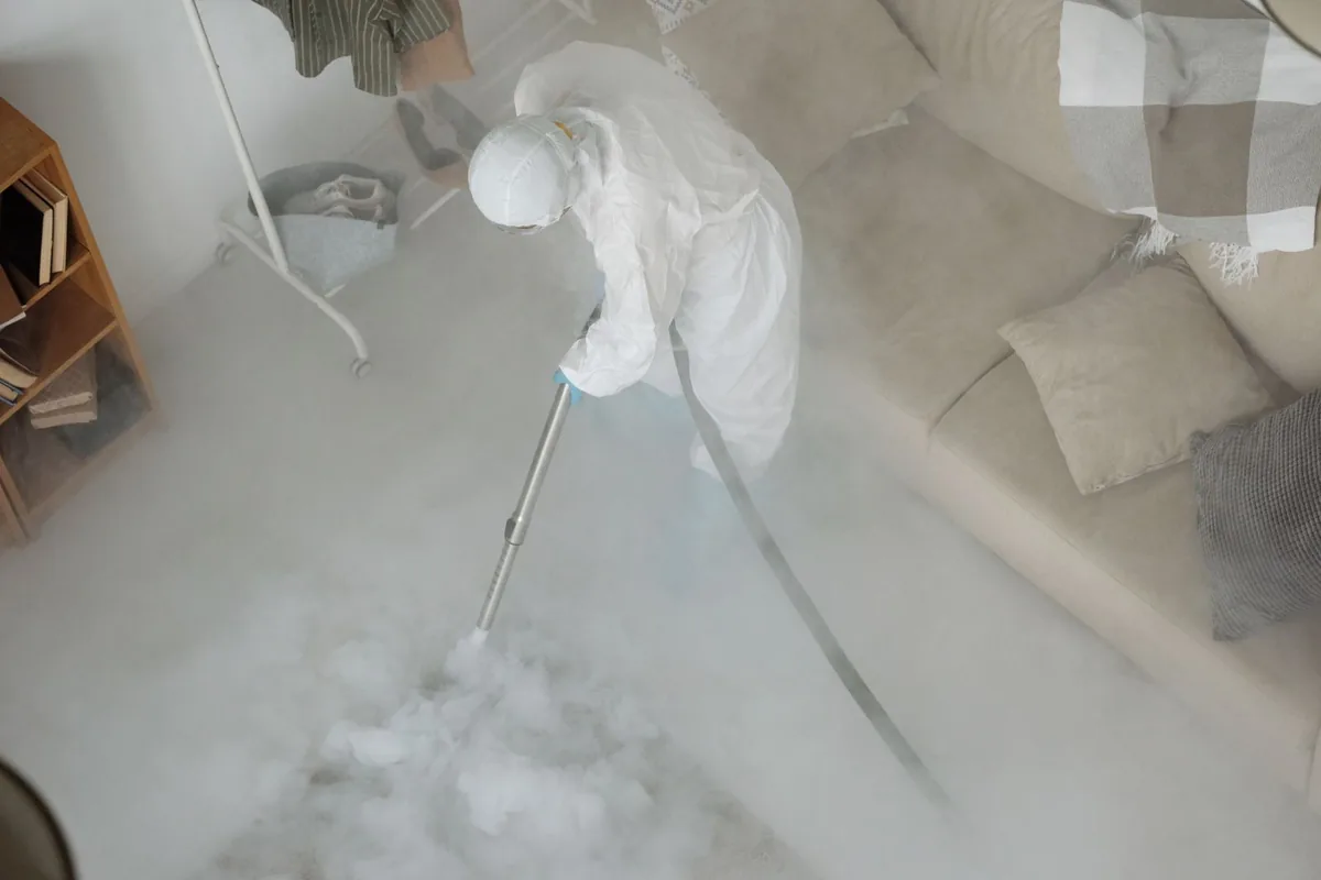 Biohazard cleanup technician in protective equipment, Red Bridge South, Kansas City, MO